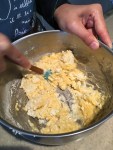 Combine the egg and grated cheese in a separate bowl and mix